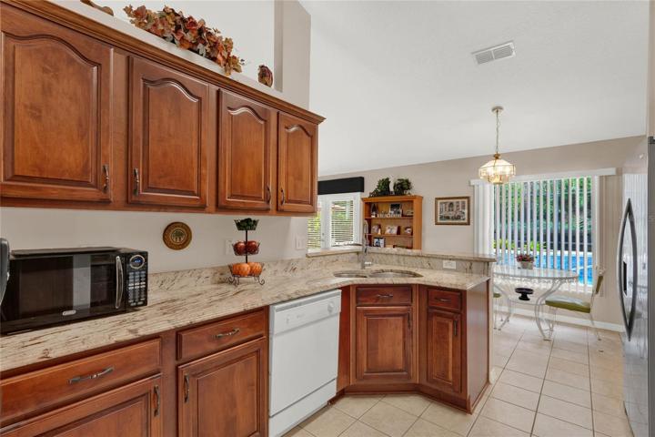 Updated granite countertops and espresso cabinetry