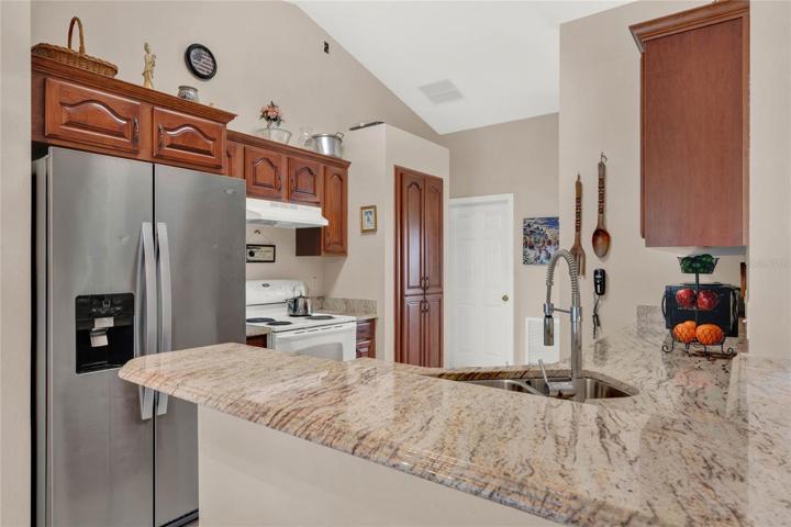 Updated granite countertops and espresso cabinetry