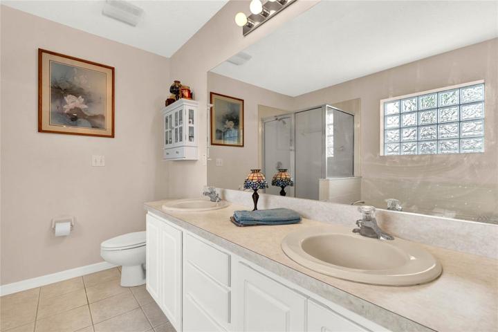 Dual vanities and separate bathtub and shower