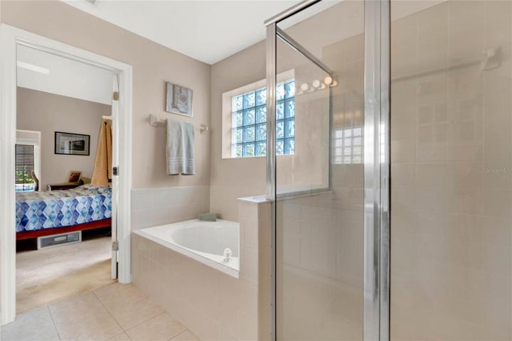 Dual vanities and separate bathtub and shower