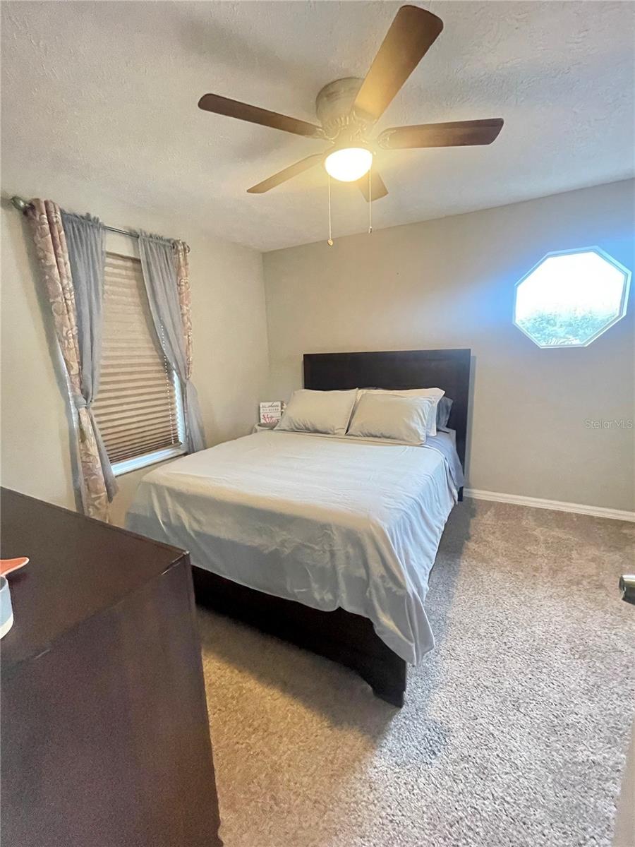 Queen bed in guest room