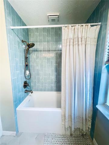 Large soaker tub/ shower combo with Bluetooth speaker/fan