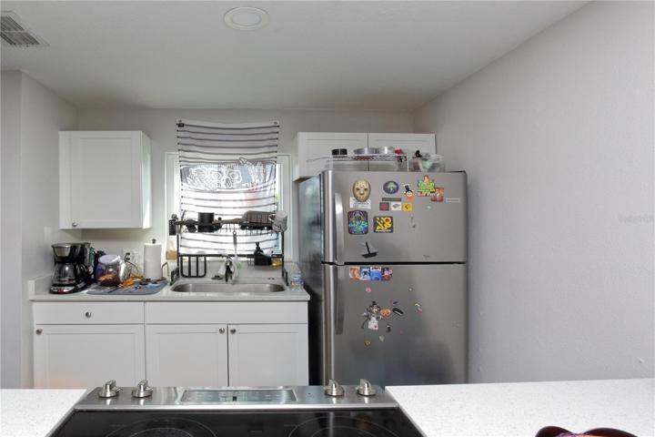 The kitchen looks out to the front/south/parking lot.