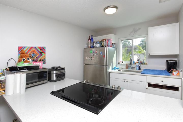 The kitchen in the downstairs unit on the right.