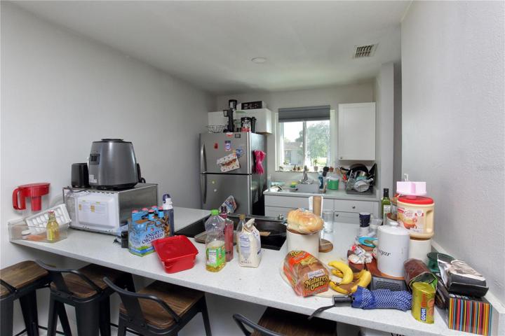The kitchen of one of the upstairs units showing the kitchen that has been remodeled.