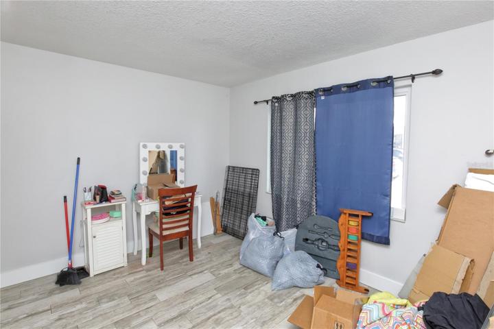 The guest bedroom of the downstairs unit on the right of the building.