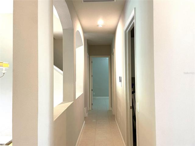 Foyer leads to Bedroom 2 and to stairs