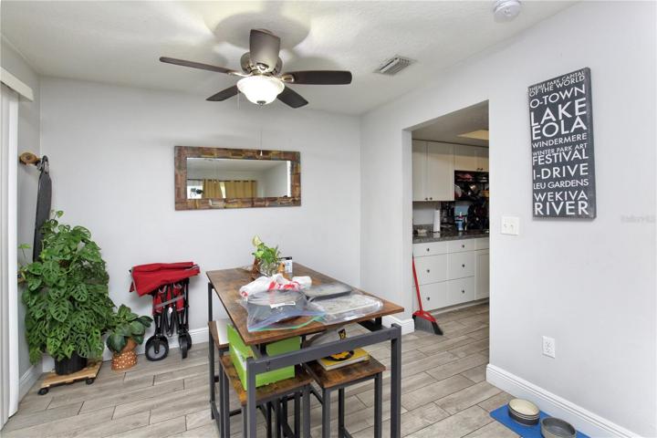 Sliding glass doors in the dining area lead to the south side of the property.