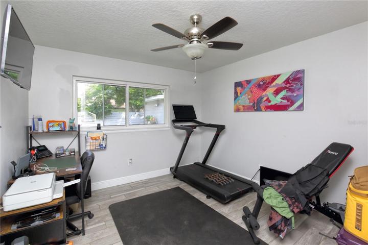 One of the guest bedrooms that has been remodeled - flooring, paint, ceiling fan, windows.