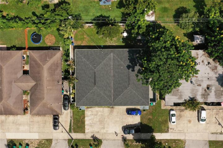 An aerial view of the quadraplex that is completely fenced.