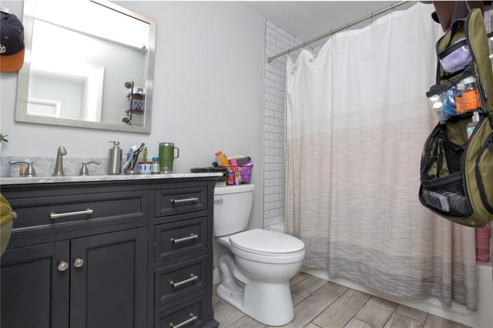 A picture of one of the remodeled units with an updated bathroom.