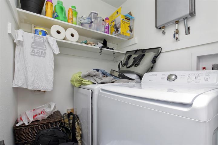 Inside laundry room and shelving are a bonus to the tenants.