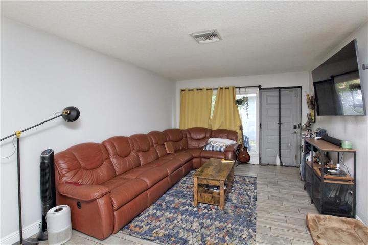 The unit in the back of the quadraplex facing east/the rear of the property.