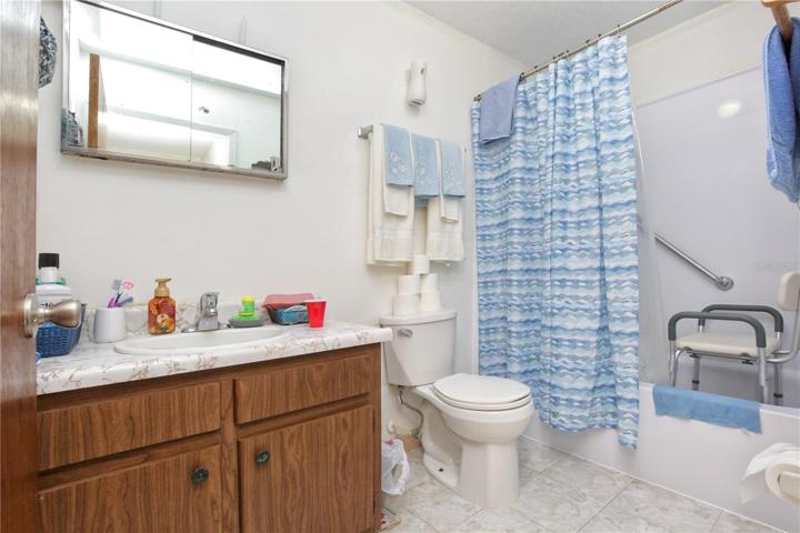 The bathroom for the unity that has not been remodeled.
