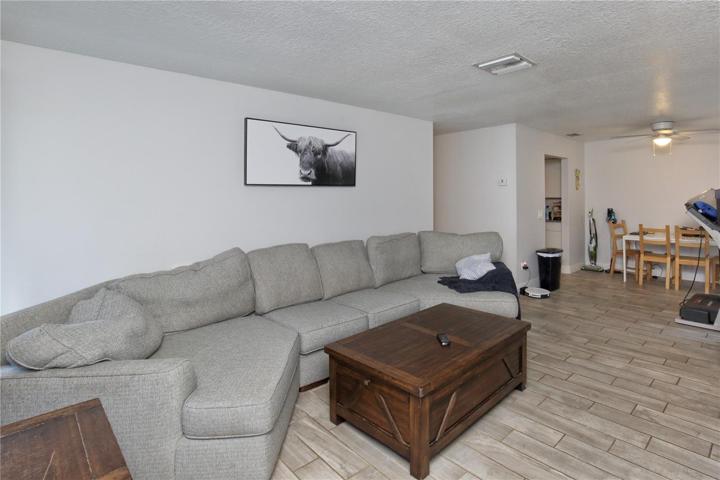 Another remodeled unit showing the living room/dining room layout.