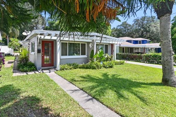 Welcome to 1209 E Harding Street.  Showing the front yard facing south.