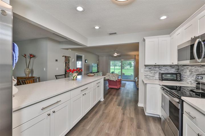 Remodeled Kitchen Stainless Steel Appliances, Stacked Stone Backsplash