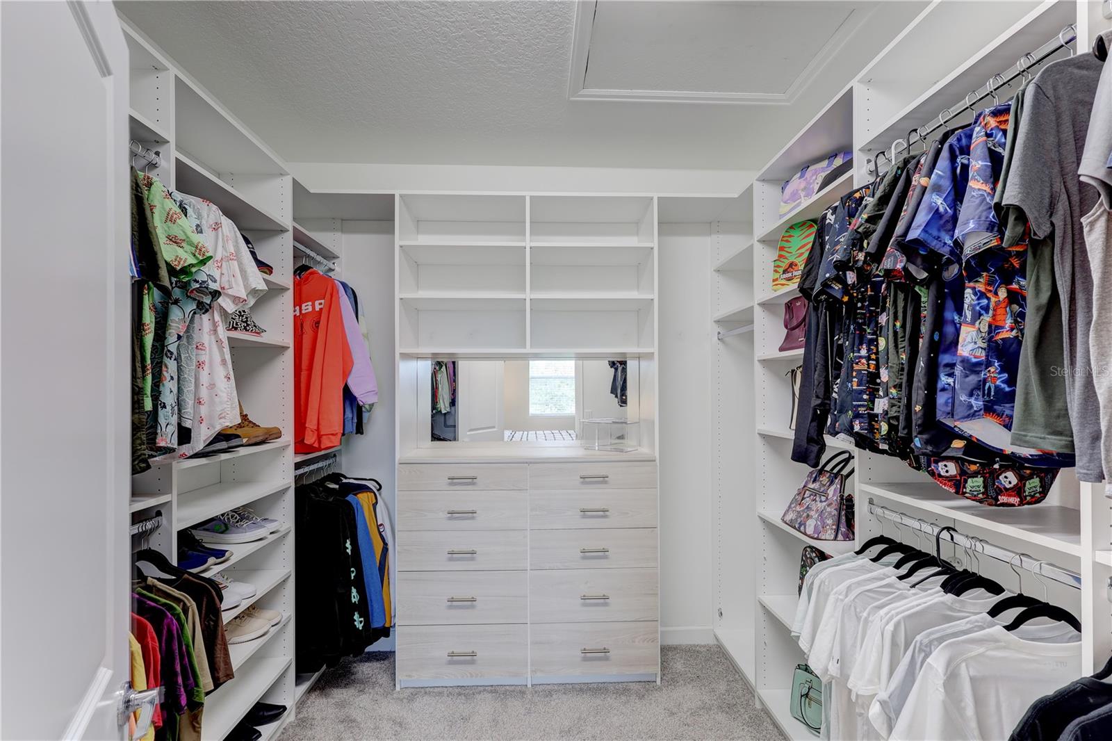 Primary Bedroom closet with custom shelving