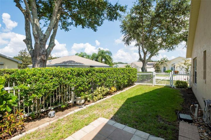 Fenced back yard with patio