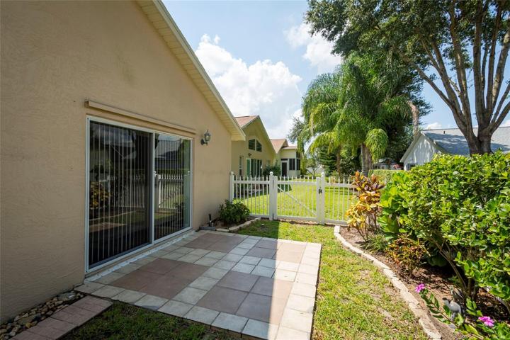 Fenced back yard with patio