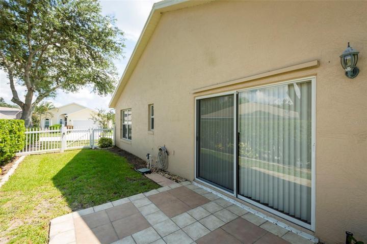 Fenced back yard with patio