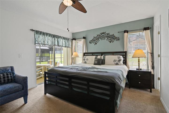 The primary suite is also light and bright with its own direct access to the lanai, walk-in closet and private en-suite bath that features a walk-in shower behind glass doors!