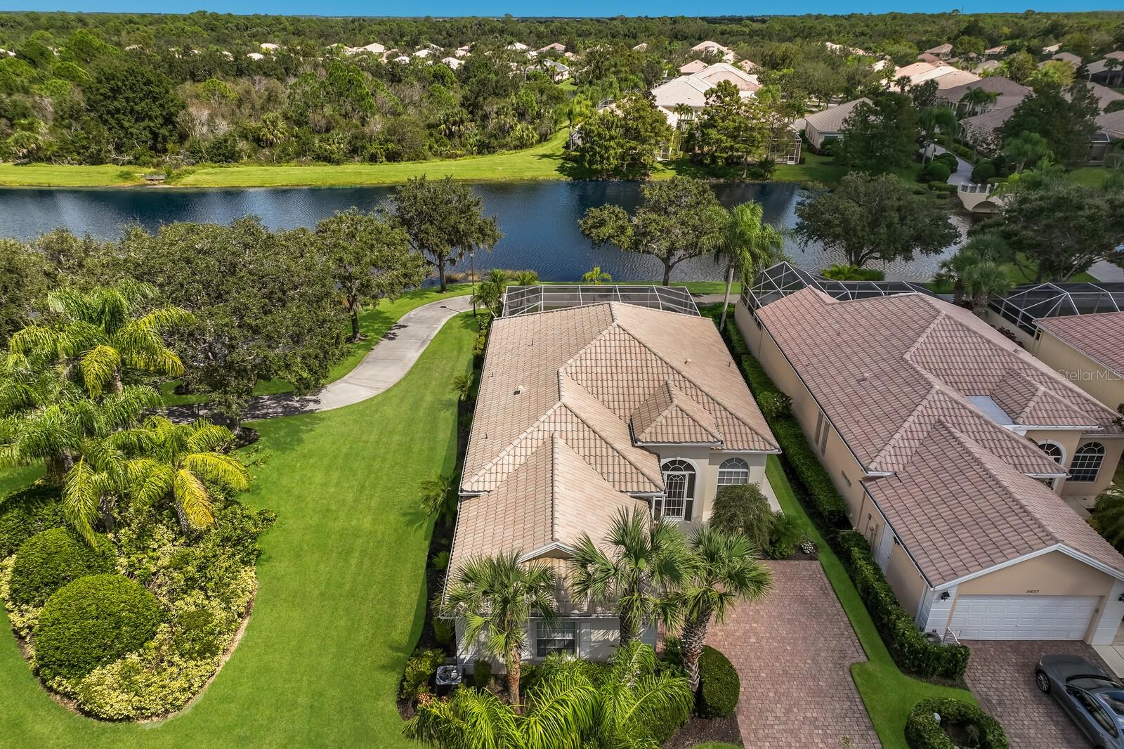 Aerial of home and surrounding preserves and lake