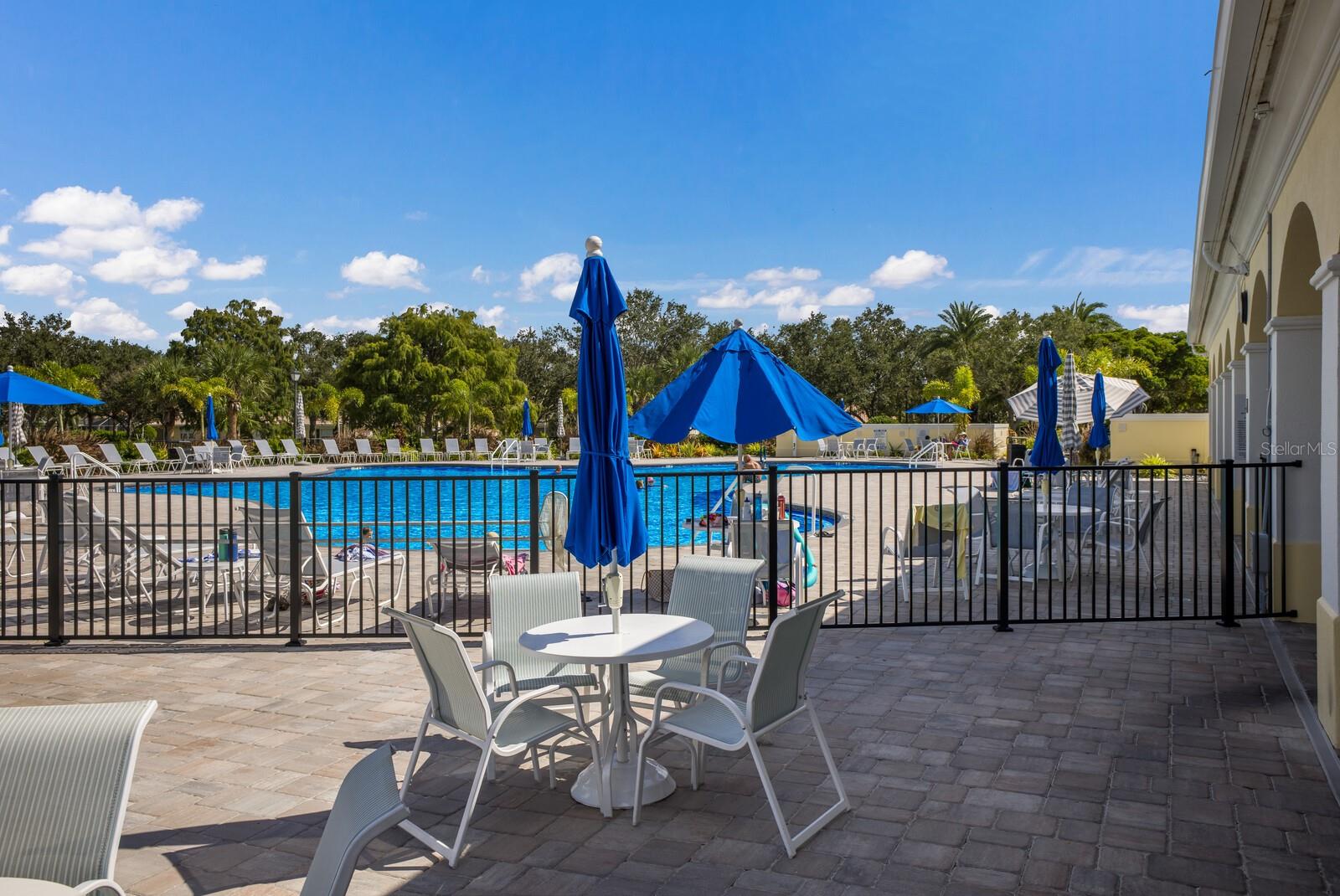 Outdoor dining by resort style pool