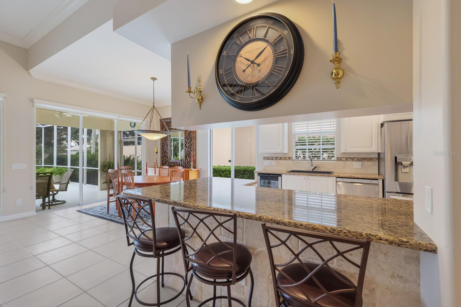 Breakfast bar to kitchen and dining