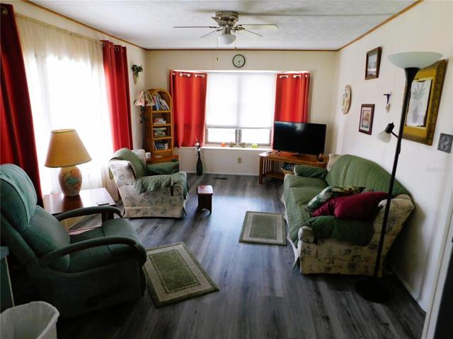 Living room is open concept with kitchen.