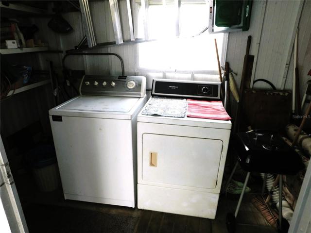Washer and Dryer are located in storage shed off carport.