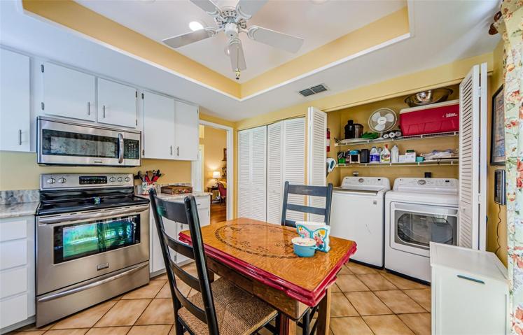 Eat in kitchen with newer appliances and convenient washer and dryer.