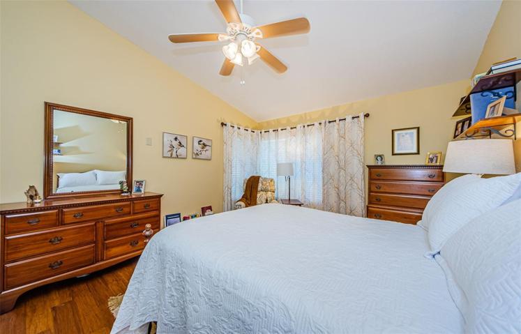 Master bedroom wtih wood flooring