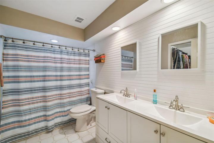 Updated on suite with dual Sinks and tile accent wall.