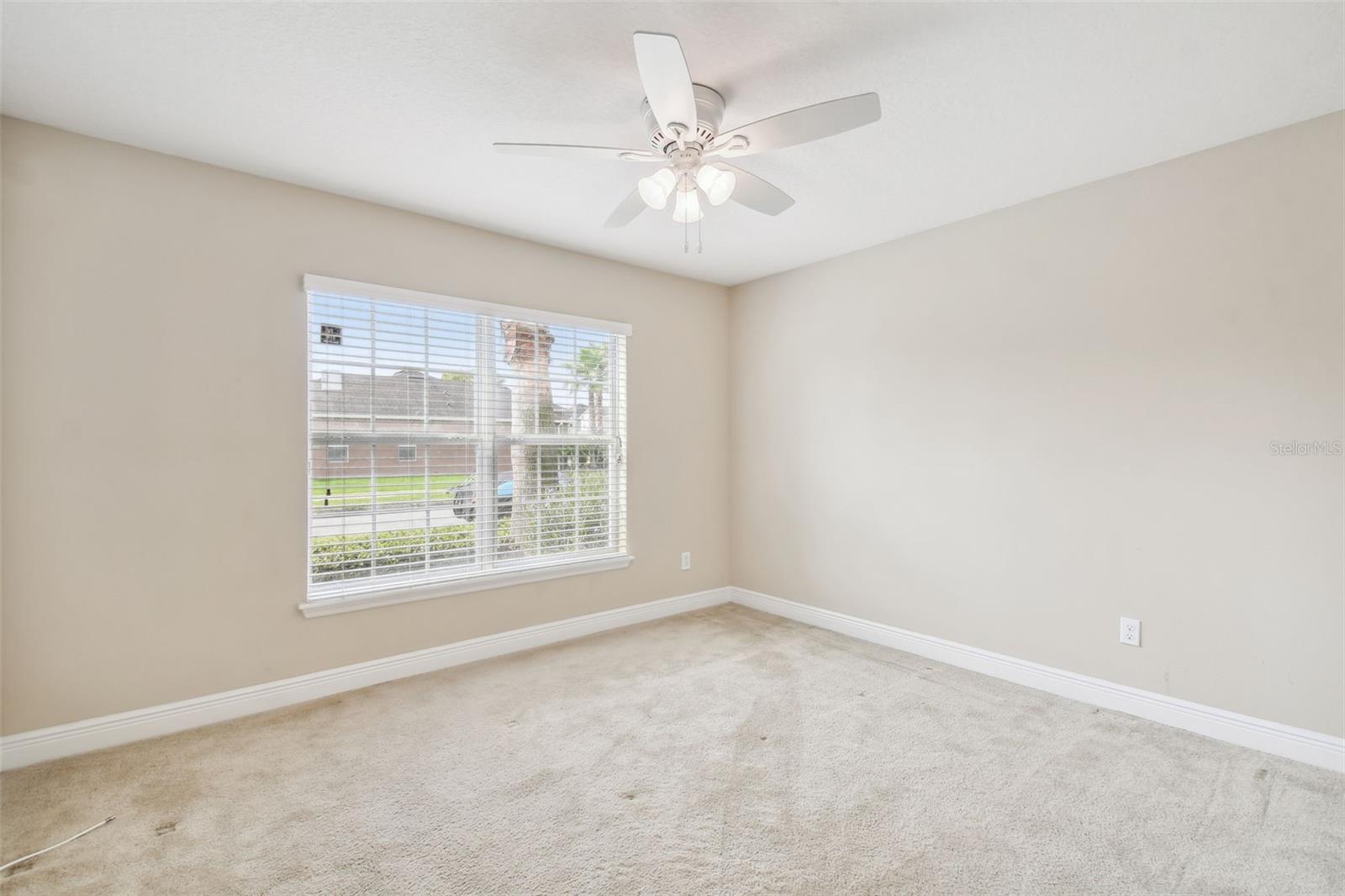 Front bedroom is the only room with carpet and the large window brings in lots of natural light