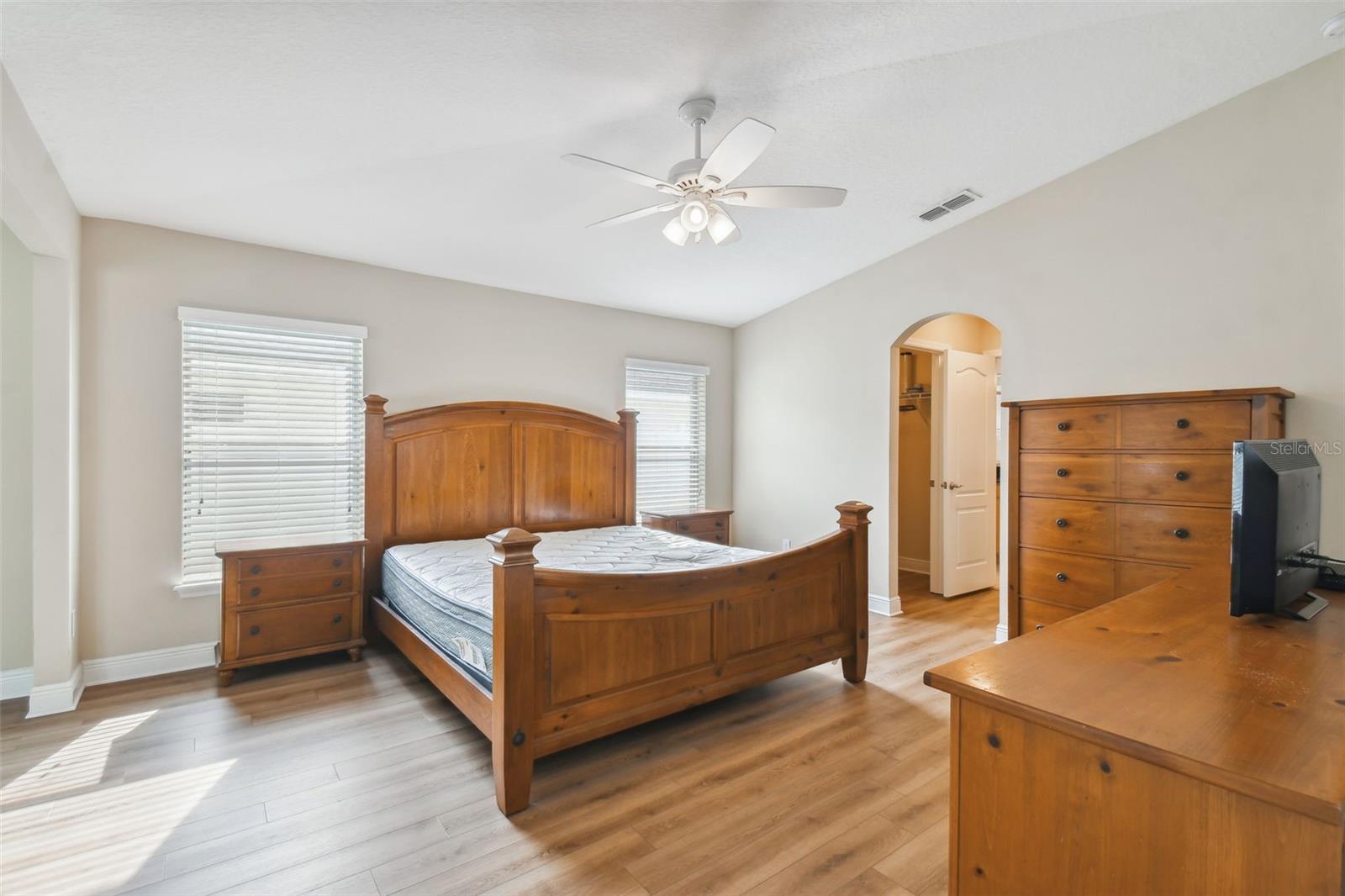 Light and bright master suite with adjoining sitting room has vinyl plank flooring installed sometime after 2018