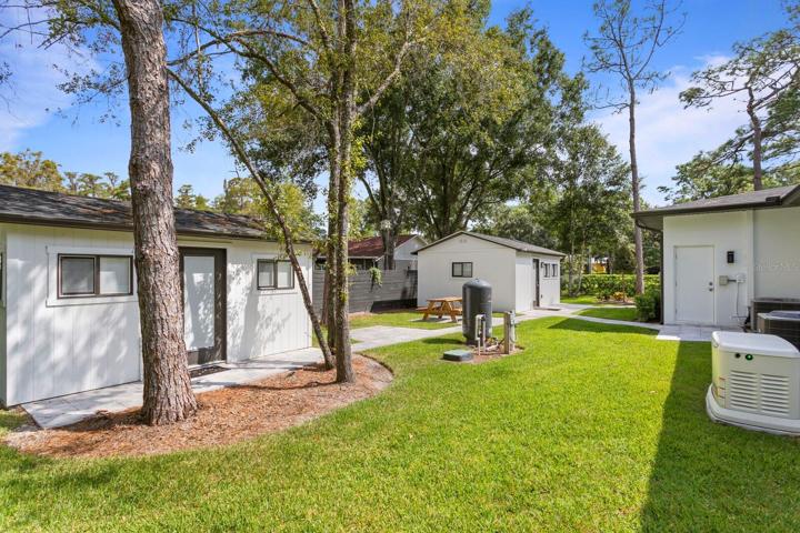 2 adjacent outbuildings on the side yard