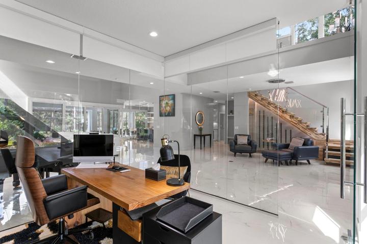 Home office includes automatic shades for privacy when needed