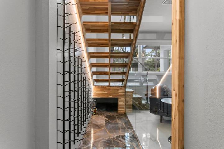 60-bottle capacity wine room below the stairs