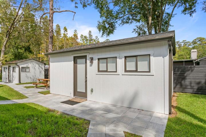 Larger of two finished outbuildings on the property
