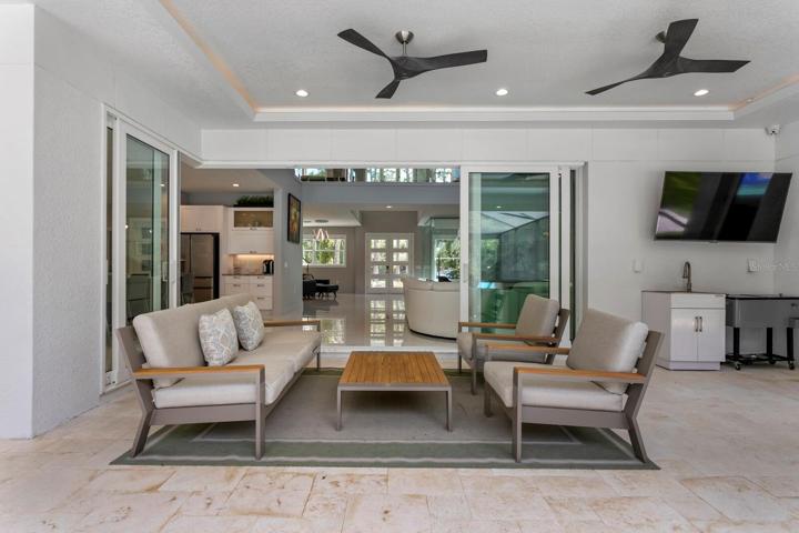 Pocketing sliding doors extend the outdoor living areas