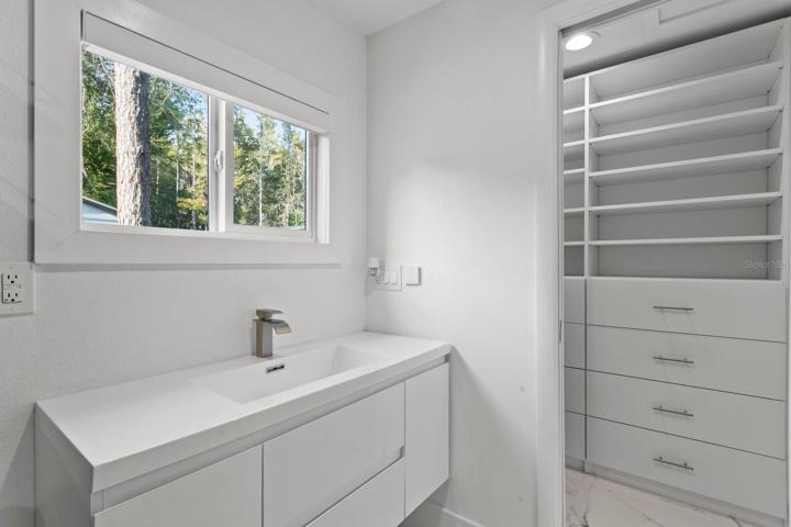 Full bath and walk-in closet in the larger outbuilding