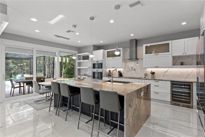 Stunning gourmet kitchen with large breakfast bar