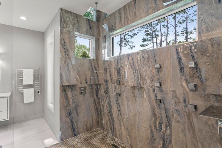 16 shower heads in the walk-in-shower