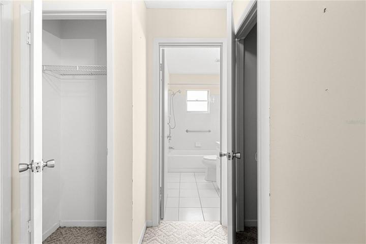 Coat & Linen Closet in Hallway dividing the bedrooms