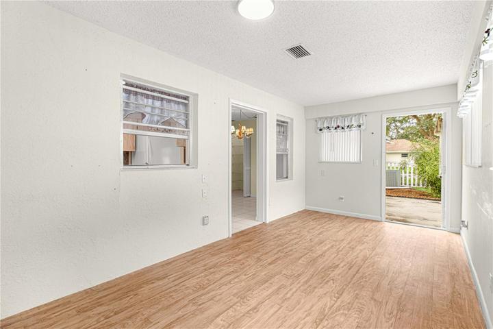 Florida Room - Door to Patio and fenced backyard