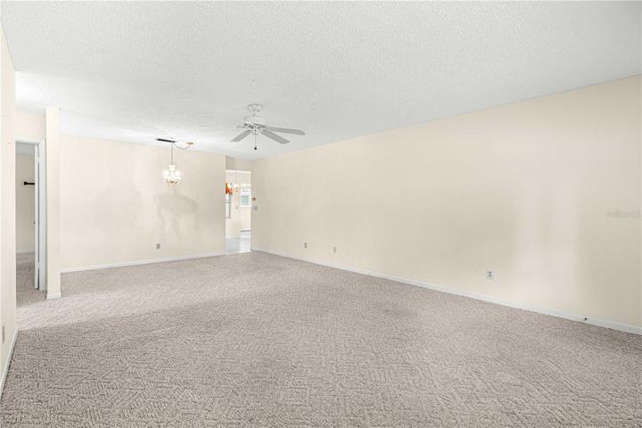 Enter home into the Living Room. Doorway to right is Kitchen. Doorway to left is bedrooms.