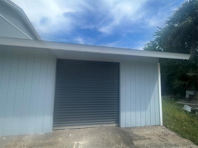 Grade level roll up door
