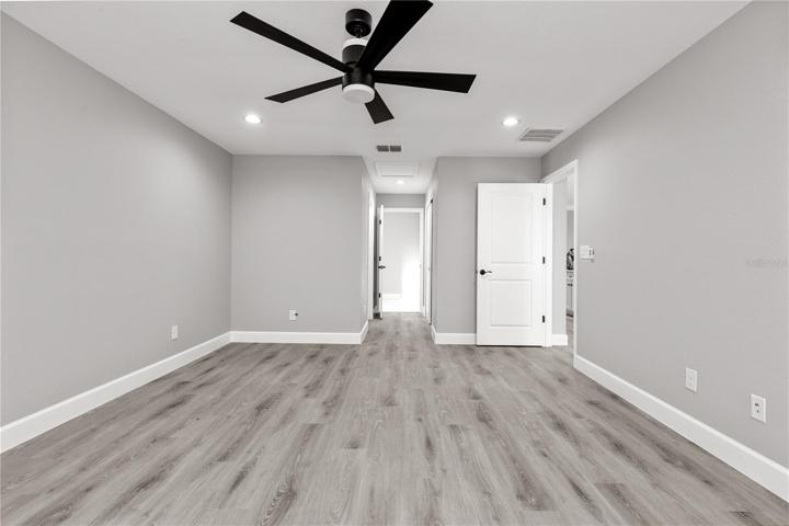 Spacious Master bedroom with spacious closets and a spa like master bath retreat!  Beautiful LVP flooring throughout the entire home with a neutral paint palette, upgraded ceiling fans, recessed lighting and modern baseboards!  This is a large master and can easily accommodate king size bed, dressers and side tables!