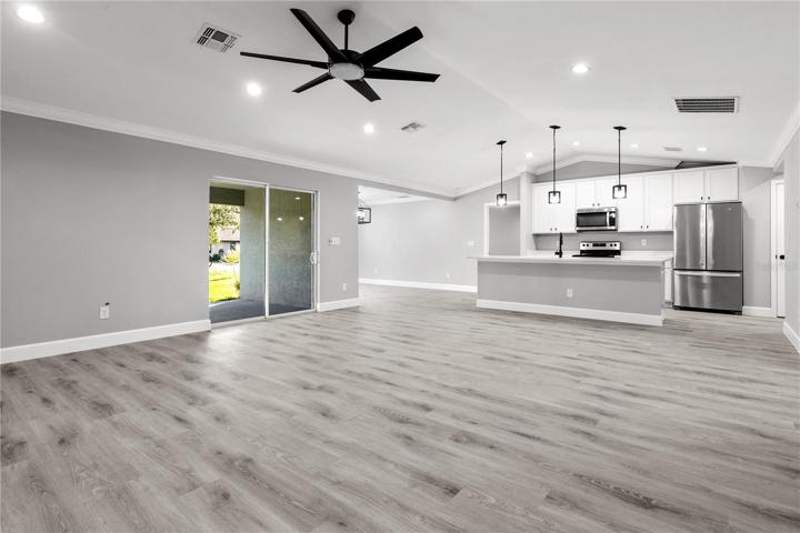 Living area/ Slider - a view towards the kitchen from the great room - pictures tell a thousand words but this home must be seen in person to appreciate the details and thoughtfulness that was put into the design!